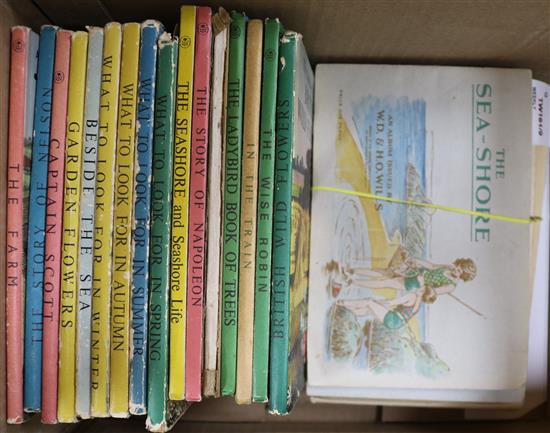 A collection of 16 Ladybird books and seven albums of tea and cigarette cards,